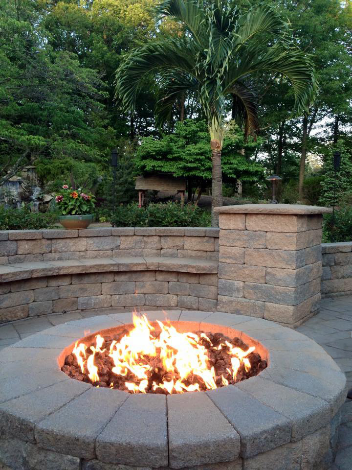 circular fire pit area on a stone patio