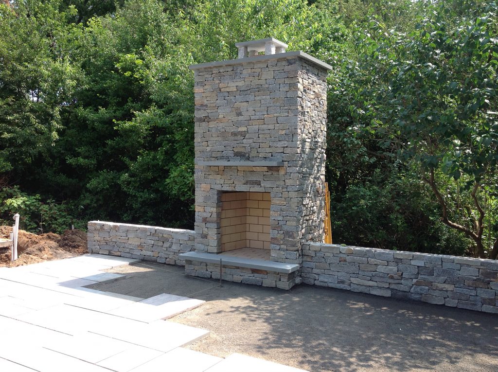 A custom outdoor fireplace chimney
